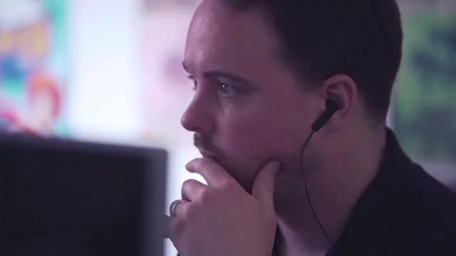 Tom Lansdale working in headphones